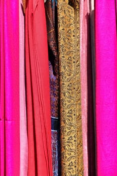 A set of scarves on a flea market with strong colors