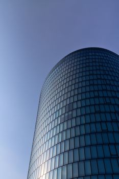 A modern skyscraper in Vienna reflecting the sunlight