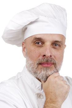Portrait of a confident, smiling chef in chef's uniform.