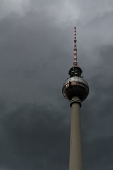 The broadcasting tower underneath threatening stormy clouds