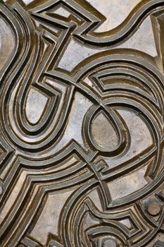 A metallic pattern of a door in Torino