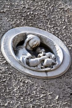 Detail of Mother Mary with her infant Jesus on a building in the center of Vienna