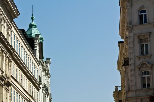 A downward street in Vienna with imperial buildings on either side