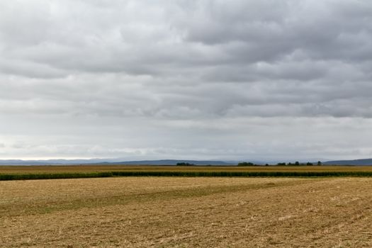 Landscape with clouds and nature in lower Austria close to Vienna showing plain fields