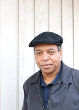 African american male posing outside.