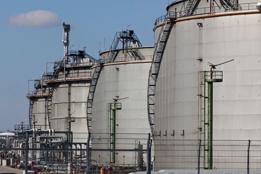 A set of gas tanks with fire extinguishers in an industrial area of Vienna