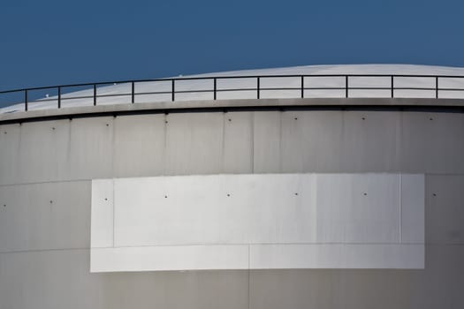 An industrial tank with a blank white label on it