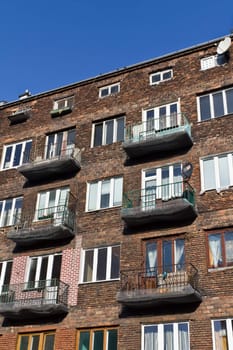 A building with an old brick facade in the center of Warsaw