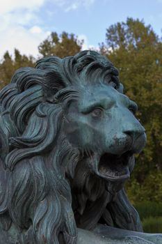 A bronze lion close to the royal palace in Madrid