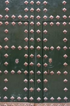 A green door in the famous monastery El Escorial in Spain