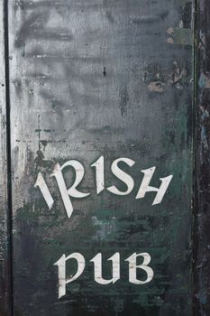 A door to an irish pub with letters on it in Madrid