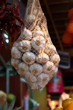 A bag of garlic at a local market in Madrid