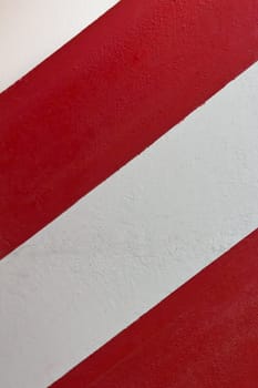 A red and white striped wall in the center of Madrid