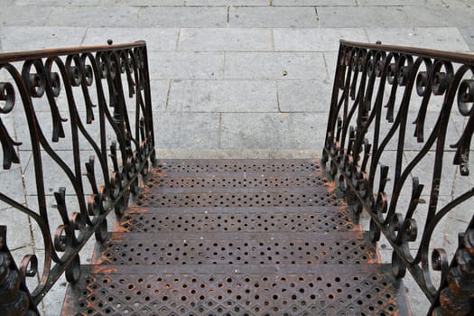 Small stairs leading downstairs in Segovia, Spain