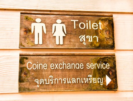 Toilet signs and coine exchange service.