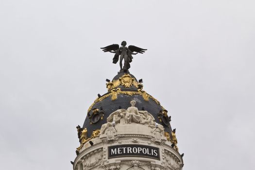 The top of the Metropolis building in the center of Madrid