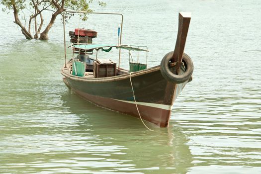 Local fishing boats. Moored in the harbor where the water is not deep.