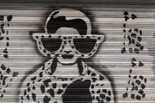 A female graffiti on a garage in Madrid