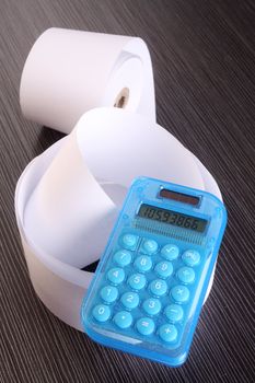 stock image of the rolled of paper and calculator