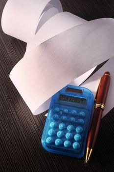 stock image of the rolled of paper and calculator