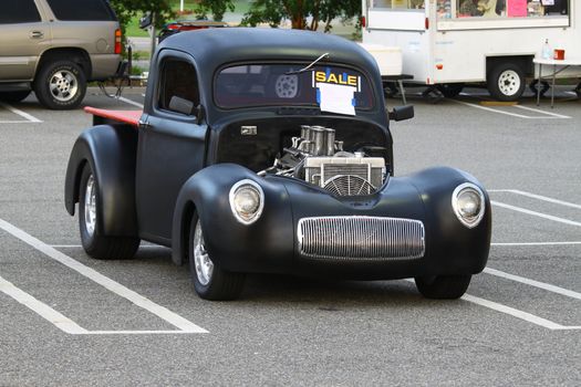 GLOUCESTER, VA, USA -SEPTEMBER 30: Vintage 1940 Willy's pickup in the Middle Peninsula Classic Cruisers Club weekly Car Show. Main Street Center. September 30, 2011 in Gloucester, VA, USA