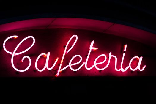 A neon sign of a cafeteria in the center of Madrid