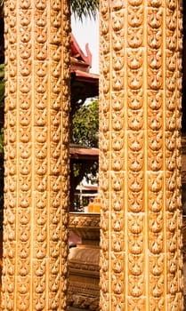 Phetchaburi, Thailand - June 13 : at wat kuti in Phetchaburi Province.
have the wall sculptures of traditional Thai style  and this is a pole of the temple in Thailand. The architecture is beautiful.