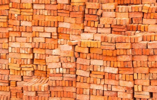 Lots of red brick. The stacked into a wall.