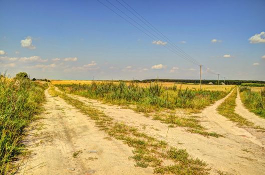 This photo present fork of dirt roads HDR.
