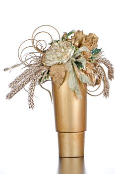 Christmas candle decorations on a golden vase.