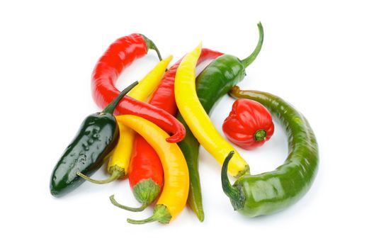 Heap of Various Chili Peppers with Red Habanero, Green Jalapeño, Yellow Santa Fee, Green and Red Peppers isolated on white background