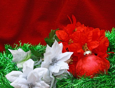 A high contrast Christmas ball and poinsettia blooms with room for your text