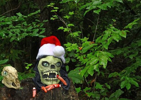 The Grim Reapers head arising from a stump in the woods along side of a Deer Skull celebrating Christmas and the Holiday season with room for your text.