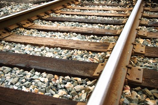 Railway tracks up-close on a sunny day.