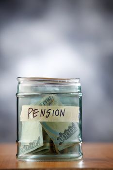 A jar of cash on the table.