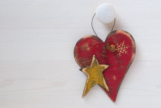 Christmas decorations in the form of hearts on a wooden background
