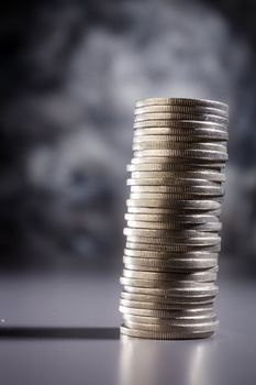 Stack of coins isolated on the background.