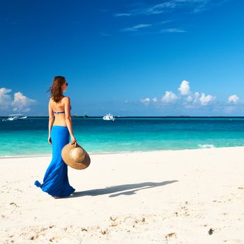 Woman in skirt at tropical beach