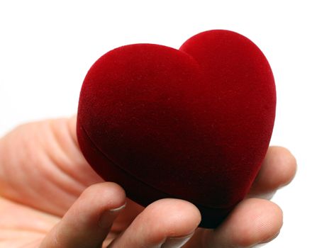 man's hand gifting heart on valentine day isolated on white