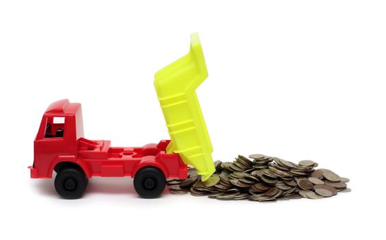 toy lorry and strew coins - business concept