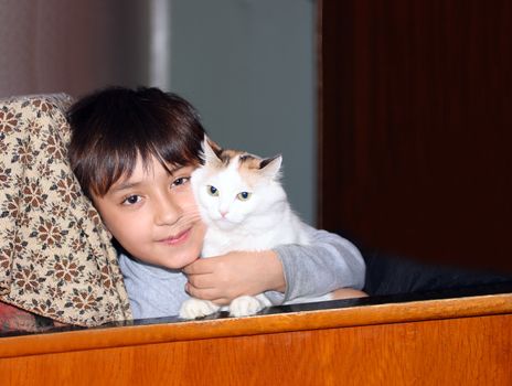 happiness - little asian boy with cat