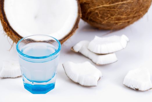freshly cut coconut and milk isolated on white background