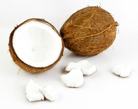 freshly cut coconut and milk isolated on white background