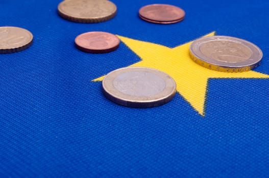 Euro Coins on Blue Flag of European Union