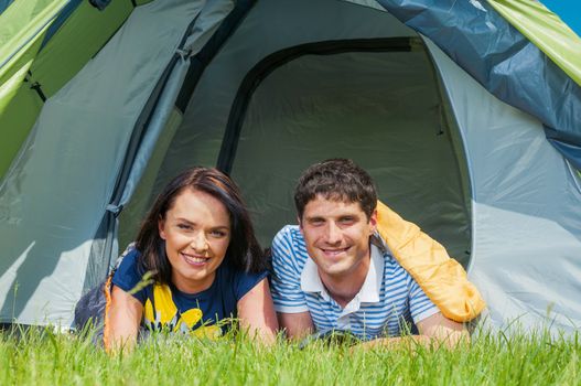 Holiday camping - Man And Woman Couple Camping In A Tent In The Countryside