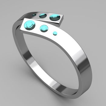 Silver ring with turquoise diamonds on gray background