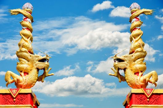 Dragon statue roll the column with nice sky background