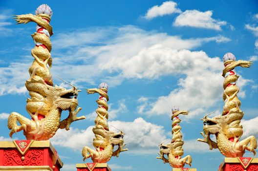 Dragon statue roll the column with nice sky background