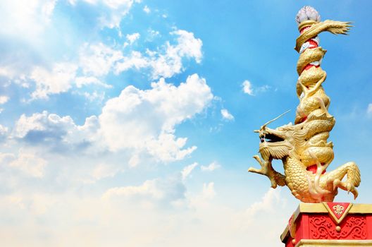 Dragon statue roll the column with nice sky background
