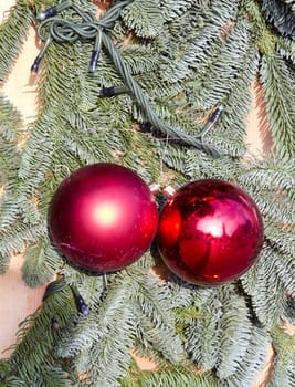 Cristmas tree plastic fir branches imitation and red toys pair.